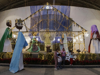 Dozens of people visit a Christmas village set up in the Tlahuac Forest in Mexico City, Mexico, on December 15, 2024. (