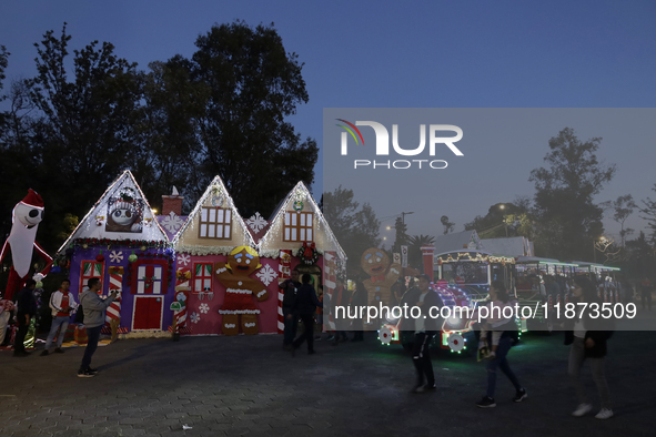 Dozens of people visit a Christmas village set up in the Tlahuac Forest in Mexico City, Mexico, on December 15, 2024. 