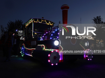 A view of a train in a Christmas village set up in the Tlahuac Forest in Mexico City, Mexico, on December 15, 2024. (