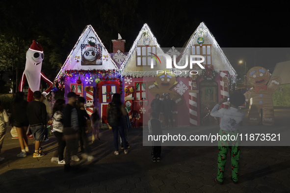 Dozens of people visit a Christmas village set up in the Tlahuac Forest in Mexico City, Mexico, on December 15, 2024. 