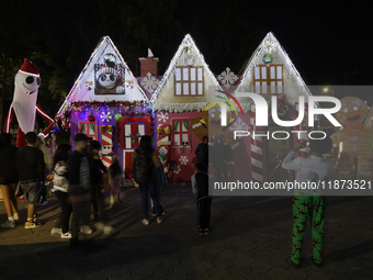 Dozens of people visit a Christmas village set up in the Tlahuac Forest in Mexico City, Mexico, on December 15, 2024. (