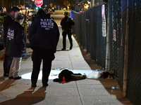 New York City Police Department crime scene investigators stage at the scene where a 26-year-old man identified as Tyreek Moore is shot and...