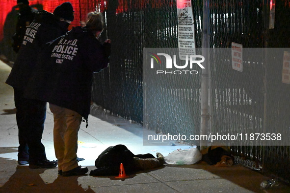 New York City Police Department crime scene investigators stage at the scene where a 26-year-old man identified as Tyreek Moore is shot and...