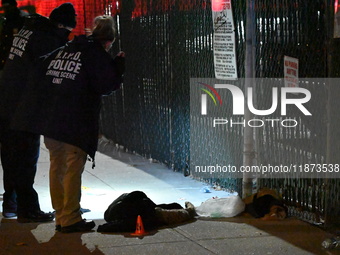 New York City Police Department crime scene investigators stage at the scene where a 26-year-old man identified as Tyreek Moore is shot and...