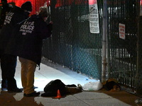 New York City Police Department crime scene investigators stage at the scene where a 26-year-old man identified as Tyreek Moore is shot and...