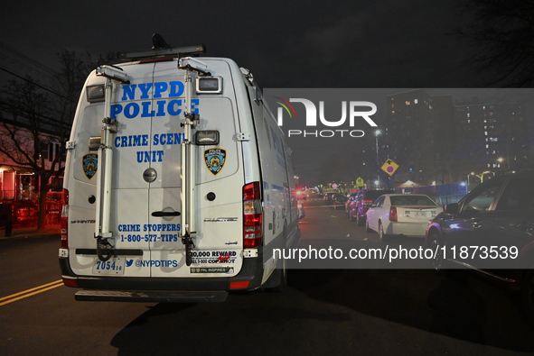 New York City Police Department crime scene investigators stage at the scene where a 26-year-old man identified as Tyreek Moore is shot and...