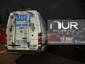 New York City Police Department crime scene investigators stage at the scene where a 26-year-old man identified as Tyreek Moore is shot and...