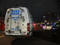 New York City Police Department crime scene investigators stage at the scene where a 26-year-old man identified as Tyreek Moore is shot and...