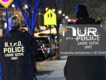 New York City Police Department crime scene investigators stage at the scene where a 26-year-old man identified as Tyreek Moore is shot and...