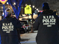 New York City Police Department crime scene investigators stage at the scene where a 26-year-old man identified as Tyreek Moore is shot and...