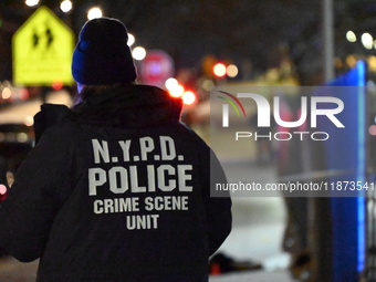 New York City Police Department crime scene investigators stage at the scene where a 26-year-old man identified as Tyreek Moore is shot and...