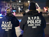 New York City Police Department crime scene investigators stage at the scene where a 26-year-old man identified as Tyreek Moore is shot and...