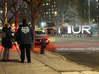 New York City Police Department crime scene investigators stage at the scene where a 26-year-old man identified as Tyreek Moore is shot and...