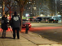 New York City Police Department crime scene investigators stage at the scene where a 26-year-old man identified as Tyreek Moore is shot and...