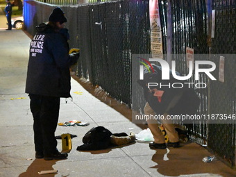 New York City Police Department crime scene investigators stage at the scene where a 26-year-old man identified as Tyreek Moore is shot and...