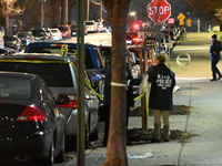 New York City Police Department crime scene investigators stage at the scene where a 26-year-old man identified as Tyreek Moore is shot and...