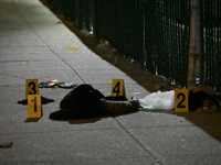 New York City Police Department crime scene investigators stage at the scene where a 26-year-old man identified as Tyreek Moore is shot and...