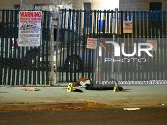 New York City Police Department crime scene investigators stage at the scene where a 26-year-old man identified as Tyreek Moore is shot and...