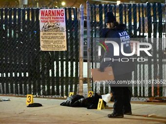 New York City Police Department crime scene investigators stage at the scene where a 26-year-old man identified as Tyreek Moore is shot and...