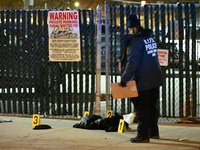 New York City Police Department crime scene investigators stage at the scene where a 26-year-old man identified as Tyreek Moore is shot and...