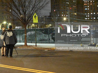 New York City Police Department crime scene investigators stage at the scene where a 26-year-old man identified as Tyreek Moore is shot and...