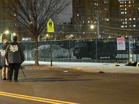 New York City Police Department crime scene investigators stage at the scene where a 26-year-old man identified as Tyreek Moore is shot and...