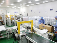 Workers work on the production line of a pharmaceutical packaging workshop in Lianyungang, Jiangsu province, China, on December 16, 2024. (