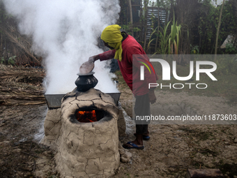 Workers prepare date jaggery after collecting juice from date palm trees in Magura, Bangladesh, on January 16, 2024. The production of date...