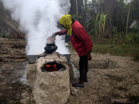 Workers prepare date jaggery after collecting juice from date palm trees in Magura, Bangladesh, on January 16, 2024. The production of date...