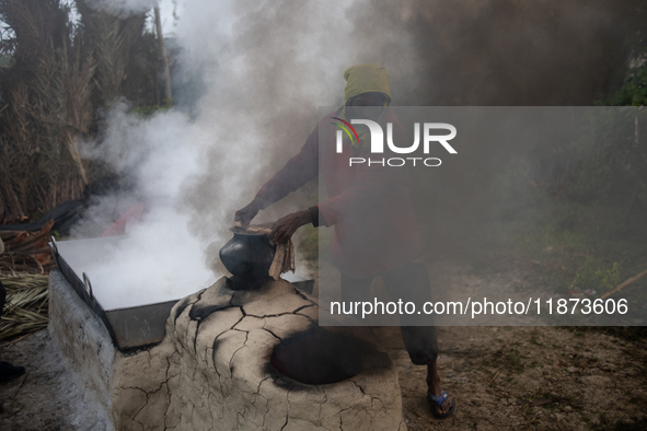 Workers prepare date jaggery after collecting juice from date palm trees in Magura, Bangladesh, on January 16, 2024. The production of date...