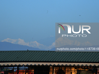 Mount Kangchenjunga is seen from Siliguri, India, on December 16, 2024. Kangchenjunga is the world's third highest mountain at 8,169 feet af...