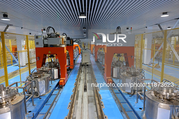 A robotic arm produces optical core products in an unmanned workshop at an enterprise in the Zaozhuang Economic Development Zone in Zaozhuan...