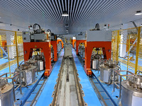 A robotic arm produces optical core products in an unmanned workshop at an enterprise in the Zaozhuang Economic Development Zone in Zaozhuan...