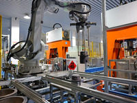 A robotic arm produces optical core products in an unmanned workshop at an enterprise in the Zaozhuang Economic Development Zone in Zaozhuan...