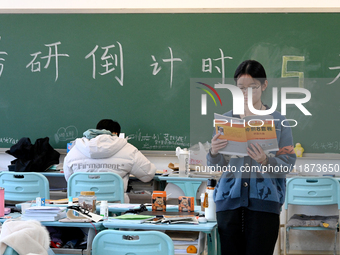 Students prepare for the 2025 national postgraduate entrance exam at Hebei University of Engineering in Handan, China, on December 16, 2024....