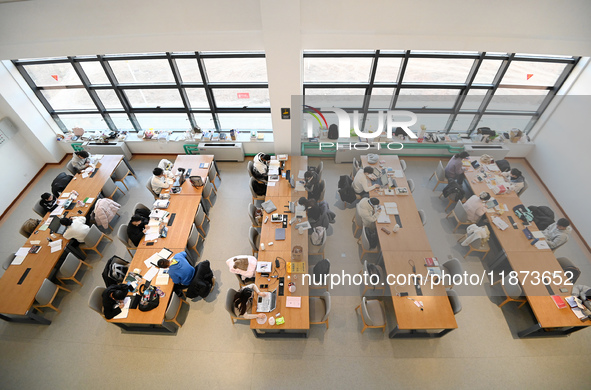 Students prepare for the 2025 national postgraduate entrance exam at Hebei University of Engineering in Handan, China, on December 16, 2024....