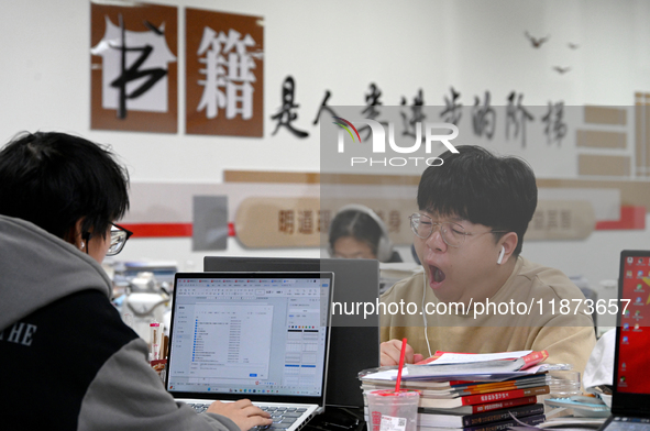 Students prepare for the 2025 national postgraduate entrance exam at Hebei University of Engineering in Handan, China, on December 16, 2024....