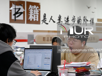 Students prepare for the 2025 national postgraduate entrance exam at Hebei University of Engineering in Handan, China, on December 16, 2024....