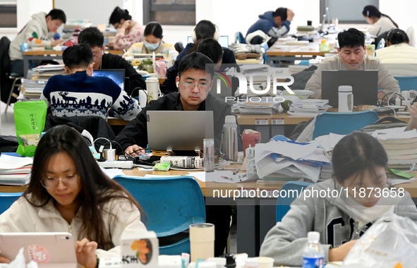 Students prepare for the 2025 national postgraduate entrance exam at Hebei University of Engineering in Handan, China, on December 16, 2024....