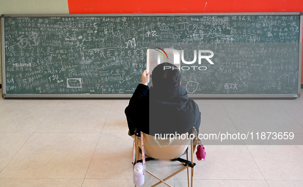 Students prepare for the 2025 national postgraduate entrance exam at Hebei University of Engineering in Handan, China, on December 16, 2024....