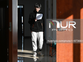 Students prepare for the 2025 national postgraduate entrance exam at Hebei University of Engineering in Handan, China, on December 16, 2024....