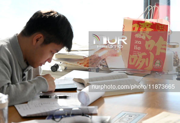 Students prepare for the 2025 national postgraduate entrance exam at Hebei University of Engineering in Handan, China, on December 16, 2024....