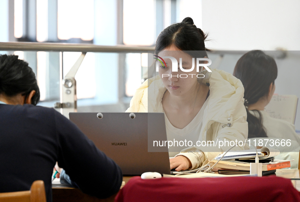 Students prepare for the 2025 national postgraduate entrance exam at Hebei University of Engineering in Handan, China, on December 16, 2024....