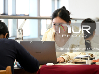 Students prepare for the 2025 national postgraduate entrance exam at Hebei University of Engineering in Handan, China, on December 16, 2024....