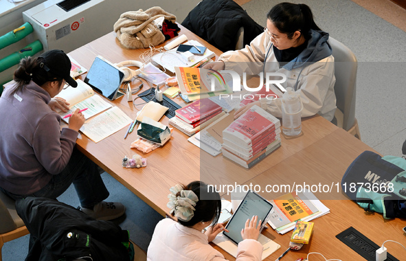 Students prepare for the 2025 national postgraduate entrance exam at Hebei University of Engineering in Handan, China, on December 16, 2024....