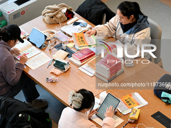 Students prepare for the 2025 national postgraduate entrance exam at Hebei University of Engineering in Handan, China, on December 16, 2024....