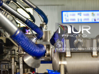 A worker works at a workshop of a water supply equipment manufacturing company in Qingzhou, China, on December 16, 2024. (