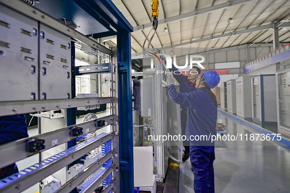 A worker works at a workshop of a water supply equipment manufacturing company in Qingzhou, China, on December 16, 2024. 