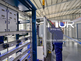 A worker works at a workshop of a water supply equipment manufacturing company in Qingzhou, China, on December 16, 2024. (