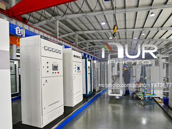 A worker works at a workshop of a water supply equipment manufacturing company in Qingzhou, China, on December 16, 2024. (